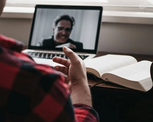 A man having an online therapy session