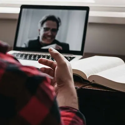 A man having an online therapy session