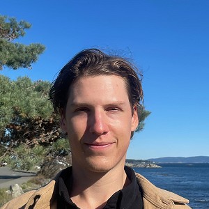 Todd Adams, recovery coach with a background in competitive sports, stands outdoors reflecting a passion for aiding individuals in their journey towards overcoming video game and substance use concerns