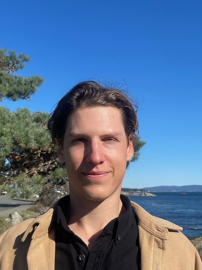Todd Adams, recovery coach with a background in competitive sports, stands outdoors reflecting a passion for aiding individuals in their journey towards overcoming video game and substance use concerns