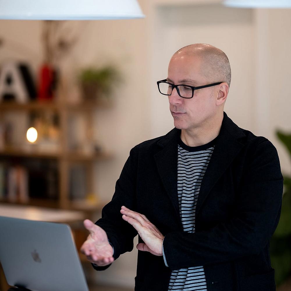 Professional Sober Coach and Interventioist Michael Walsh conducts a 1-on-1 recovery coaching session using his laptop through a secure video call