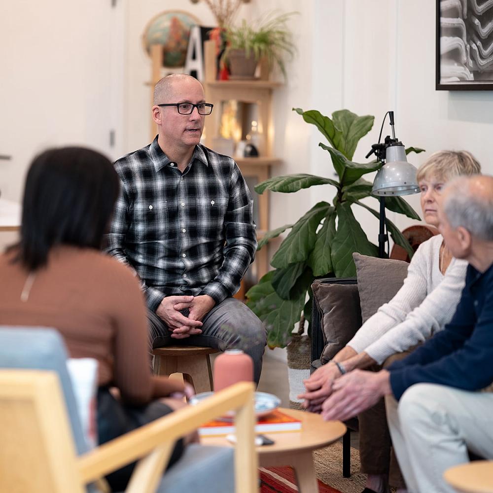 Professional Sober Coach Michael Walsh addresses a family during an intervention for drug or alcohol use