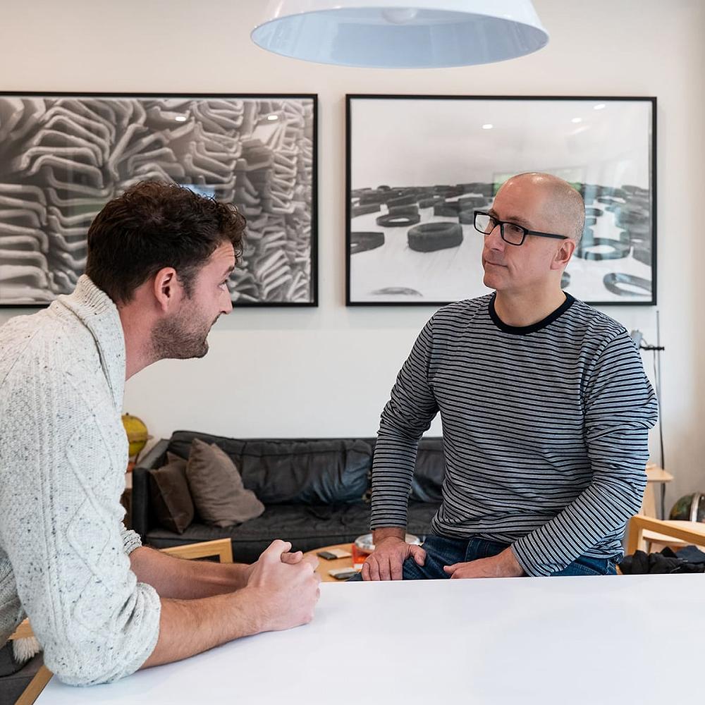 Certified Recovery Coach Michael Walsh speaking with a middle-aged man during a sober coaching session to discuss taking control of drug and alcohol use