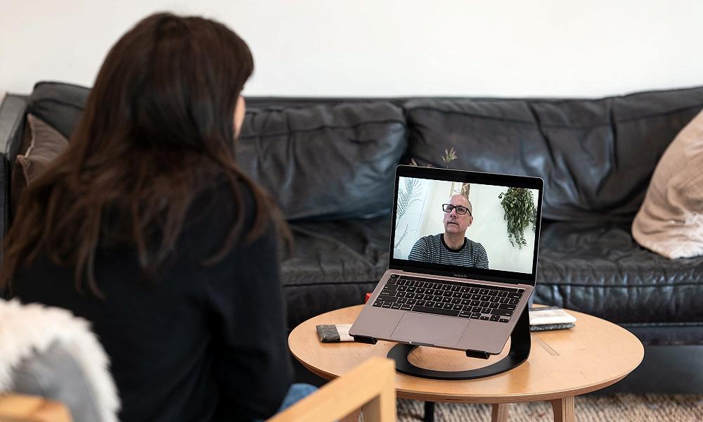 A young woman takes part in an online sober coaching session hosted by Michael Walsh, Certified Recovery Coach and Canadian Intervention specialist